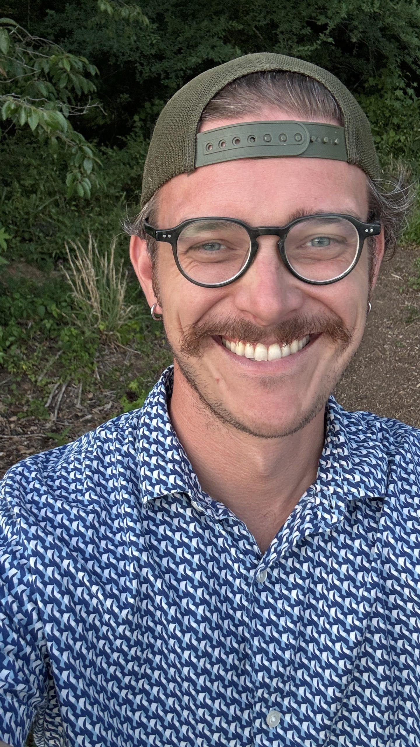 Photo of Zachary wearing a hat, smiling